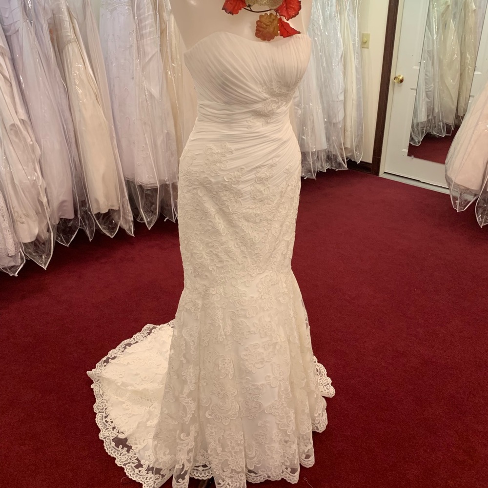 Venus ivory lace strapless wedding gown.